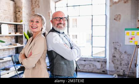 Portrait of two happy and smiling colleagues at work, concept of creative team, designers and architects, copy space an 16:9 format Stock Photo