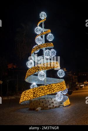 Spiral Christmas tree illuminated with LED lights Stock Photo