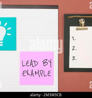 Text caption presenting Lead By Example. Business showcase Be a mentor leader follow the rules give examples Coach Stock Photo