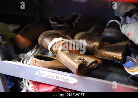 Cologne, Germany. 15th Dec, 2022. A compartment in the cold bus where men's shoes lie for distribution. The nights in North Rhine-Westphalia are getting colder and yet many homeless people have to spend the night outdoors. Help is provided by so-called cold buses. Credit: Sascha Thelen/dpa/Alamy Live News Stock Photo