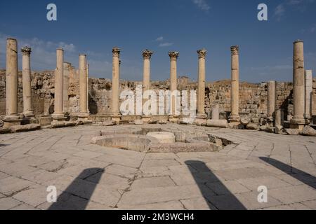 Agora, the Ancient Market Square of Gerasa with Corinthian Columns in Jerash, Jordan with the Central Fountain of the Macellum Stock Photo