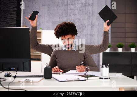 Happy Busy Business Man Multitasking. Employee Workload Stock Photo