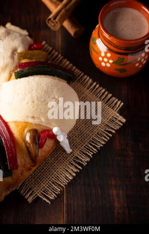 Traditional Kings day cake also called Rosca de Reyes, roscon, Epiphany Cake and with a clay Jarrito. Mexican tradition on January 5th Stock Photo