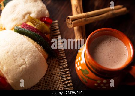 Traditional Kings day cake also called Rosca de Reyes, roscon, Epiphany Cake and with a clay Jarrito. Mexican tradition on January 5th Stock Photo