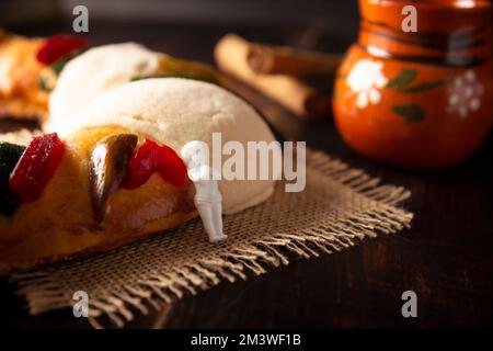 Traditional Kings day cake also called Rosca de Reyes, roscon, Epiphany Cake and with a clay Jarrito. Mexican tradition on January 5th Stock Photo