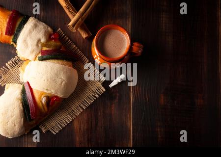 Traditional Kings day cake also called Rosca de Reyes, roscon, Epiphany Cake and with a clay Jarrito. Mexican tradition on January 5th Stock Photo
