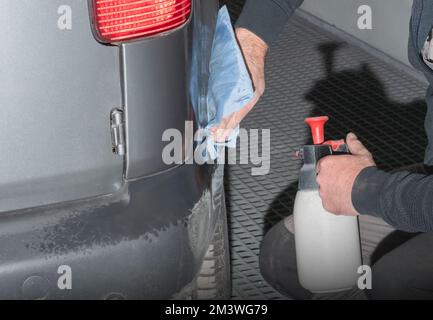 Pre-cleaning of areas on the car body, for subsequent painting Stock Photo