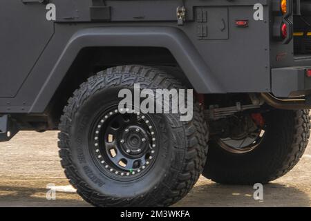 Surabaya, September 2022: Back wheel of the military suv car. Tire and wheel details Stock Photo