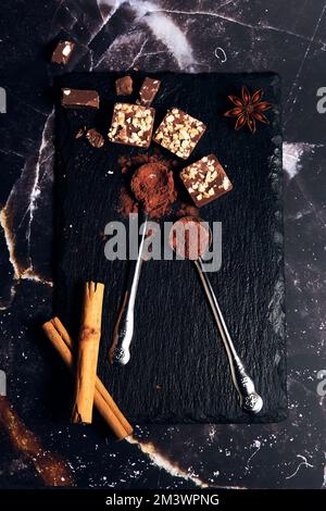 a variety of chocolates on a dark background Stock Photo