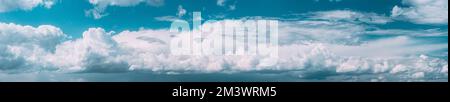 Bright Colorful Panorama Of Cloudy Sky. Natural Day Cloudy Sky Abstract Background. Panoramic View Of Cumulus Clouds. Abstract Light Blue Color. Copy Stock Photo