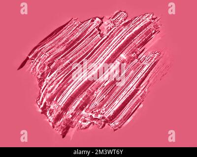 Aesthetic texture of red magenta liquid cosmetic gel. Demonstration red magenta color of 2023 Viva Magenta in makeup and cosmetic. Abstract background brush strokes on red Viva Magenta background. Copy space Stock Photo