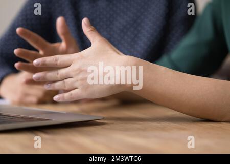 Hands of business woman sitting at work wooden table Stock Photo