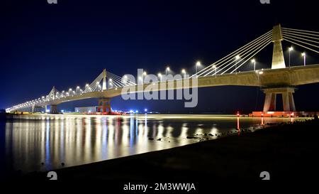 Iconic Payra bridge illuminates at night over River Payra in Bangladesh Stock Photo
