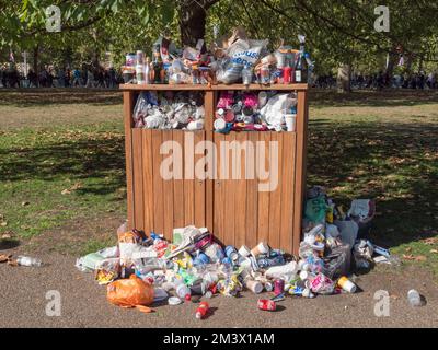 Overflowing public rubbish bins in St James Park, London, UK. Stock Photo