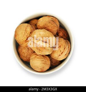 full bowl of walnuts on a white background Stock Photo