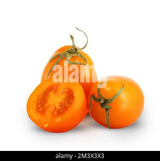 three yellow tomatoes on a white background Stock Photo