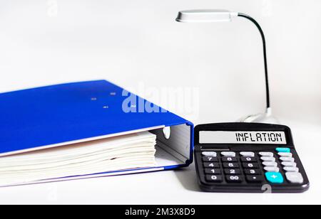 INFLATION word on calculator in Fed idea view interest rate hike, global economy and inflation control, US dollar inflation Stock Photo