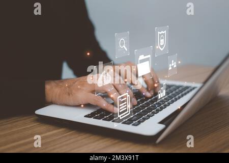 Document Management System (DMS) Online Document Database . business man using laptop access files document on viritual screen, document management sy Stock Photo