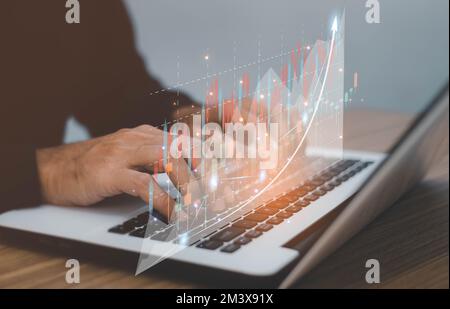 Male trader investor analyst holding smartphone in hand analyzing stock market trading charts indexes data checking price using mobile stockmarket exc Stock Photo