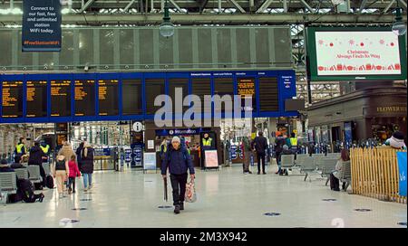 Glasgow, Scotland, UK 17th December, 2022. GMT rail strike saw a picket line outside central station with empty timetable board and few passengers on the concourse within . Credit Gerard Ferry/Alamy Live News Stock Photo