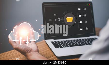Businessman using a computer to document management concept, online documentation database and digital file storage system or software, records keepin Stock Photo