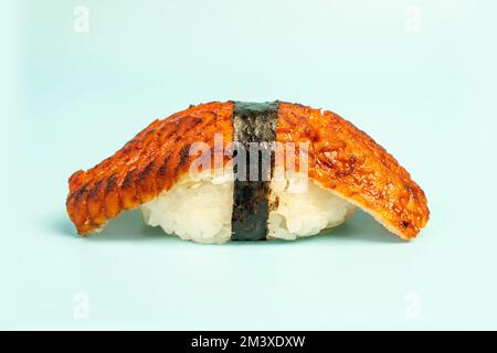 Sushi nigiri with eel Unagi on blue background. Japanese traditional cuisine. sushi close-up. Stock Photo