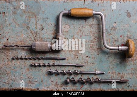 Rotterdam, Netherlands - 11-11-2022: Vintage brace or hand drill with extra drills flat lay top view Stock Photo