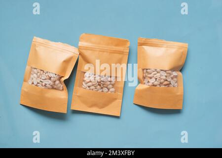 top view of peanuts in a packet on table  Stock Photo