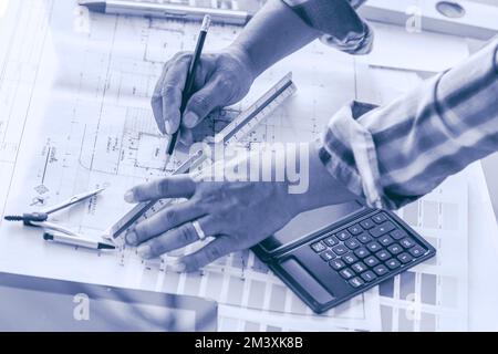 Architect Home Designer closeup hand drawing sketch new house plant project blue color tone. Stock Photo