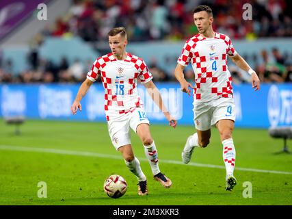 Croatia's Mislav Orsic (left) and Ivan Perisic during the FIFA World Cup third place play-off match at the Khalifa International Stadium, Doha. Picture date: Saturday December 17, 2022. Stock Photo