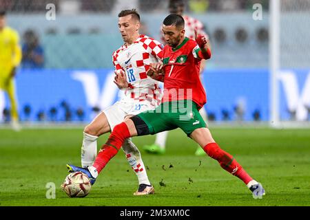 DOHA, QATAR - DECEMBER 17: Mislav Orsic of Croatia battles for the ball with Hakim Ziyech of Morocco during the 3rd Place - FIFA World Cup Qatar 2022 match between Croatia and Morocco at the Khalifa International Stadium on December 17, 2022 in Doha, Qatar (Photo by Pablo Morano/BSR Agency) Stock Photo