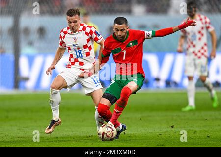 DOHA, QATAR - DECEMBER 17: Mislav Orsic of Croatia battles for the ball with Hakim Ziyech of Morocco during the 3rd Place - FIFA World Cup Qatar 2022 match between Croatia and Morocco at the Khalifa International Stadium on December 17, 2022 in Doha, Qatar (Photo by Pablo Morano/BSR Agency) Stock Photo