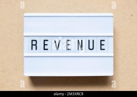 Lightbox with word revenue on wood background Stock Photo
