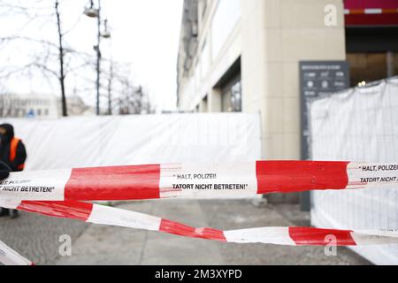 12/17/2022, Berlin, Germany, Police tape in front of the locked hotel from the outside. The day after the accident - the Berlin Aquadom was completely closed off. AquaDom in the Berlin hotel 'Radisson Blu' burst  on friday 12/16/22 and around 1 million liters of water with all the fish spilled out..