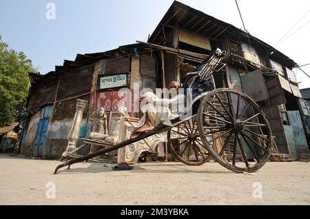 Hand pulled rikshaws are still common in the streets Stock Photo