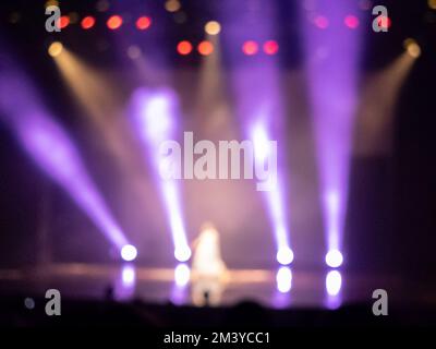 Artist on concert stage blurred background with neon light Stock Photo
