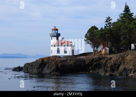 A beautiful view of the Lime Kiln Lighthouse located on San Juan Island overlooking Dead Man's Bay Stock Photo