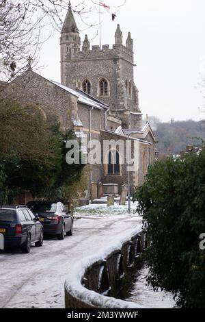 Old Amersham, Buckinghamshire, UK. 17th December, 2022. Snow by the Parish Church of St Mary the Virgin in Old Amersham. A yellow weather warning in place this evening for ice. Temperatures are, however, due to rise substantially tomorrow followed by heavy rain. Credit: Maureen McLean/Alamy Live News Stock Photo