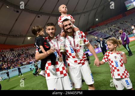 From left: Andrej KRAMARIC (CRO) with son, Mateo KOVACIC (CRO) with children after award ceremony, third place match, game for 3rd place, game 63, Croatia (CRO) - Morocco (MAR) 2-1 on December 17th, 2022, Khalifa International Stadium Football World Cup 20122 in Qatar from 20.11. - 18.12.2022 ? Stock Photo