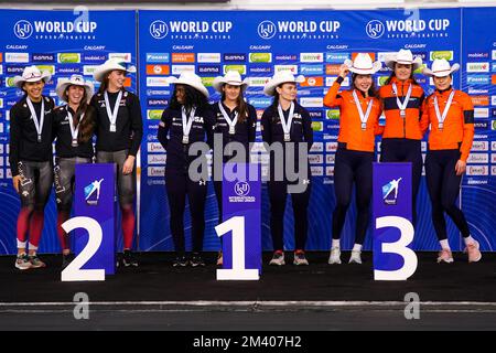 CALGARY, CANADA - DECEMBER 18: Carolina Hiller of Canada, Brooklyn McDougall of Canada and Ivanie Blondin of Canada, winner of the silver medal, Erin Jackson of United States of America, McKenzie Browne of United States of America and Kimi Goetz of United States of America, winner of the golden medal and Michelle de Jong of The Netherlands, Femke Kok of The Netherlands and Isabel Grevelt of The Netherlands, winner of the bronze medal reacts during the medal ceremony after competing on the Team Sprint Women Division A during the ISU Speed Skating World Cup 4 on December 18, 2022 in Calgary, Can Stock Photo
