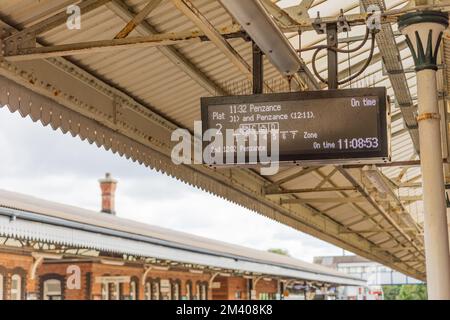 Truro Train Station with a Timetable Digital Display Attached to the Roof of the Station Above the Platform in Cornwall. Stock Photo