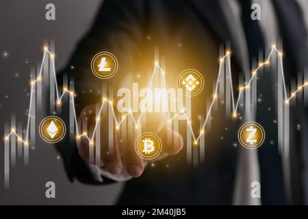 Businessman Hand and Finger Press or Touch Center Stock Graph and Cryptocurrency Icon. Financial, Economics, Business and Technology Concept Stock Photo