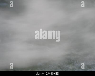 Blurry white mist or smoke or steam on black background, Pollution and burning Stock Photo