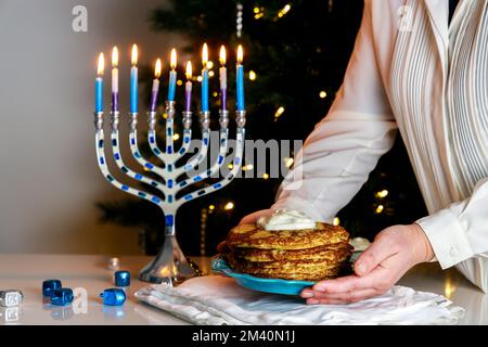 The crispy potato latkes served during Hanukkah are traditional Jewish food dish. Stock Photo