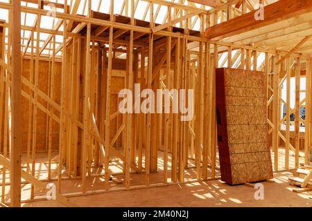 House under construction is framed with beams. Stock Photo