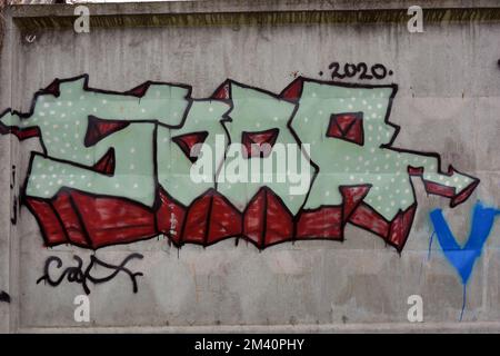 Graffiti word SOOR, drawn by a lapdog in sky blue, cyan, blue with red letters with an broken smiles. Graphic design made in chaotic way. Stock Photo