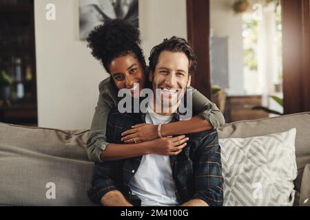Nothing beats spending time with the person you love. Portrait of an affectionate young couple spending the day together at home. Stock Photo