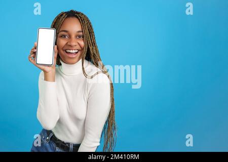 Happy african woman showing a mobile screen Stock Photo