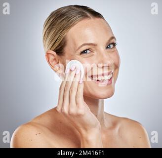 Woman, face or cotton pad for skincare grooming, dermatology cleaning product or facial acne treatment. Portrait, smile or happy beauty model with Stock Photo