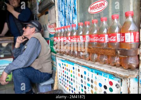 Interesting scenes from the local daily market in Ozurgeti town close to the coast of a Red sea, a shop selling gasoline in plastic bottles,  Georgia Stock Photo